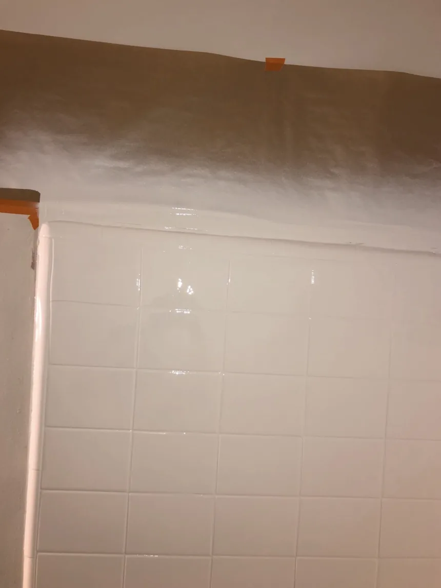 A refinished tile wall with an even, smooth finish across tile and grout.